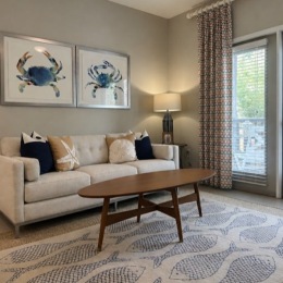 a living room with a couch and coffee table