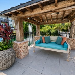 a covered patio with a couch