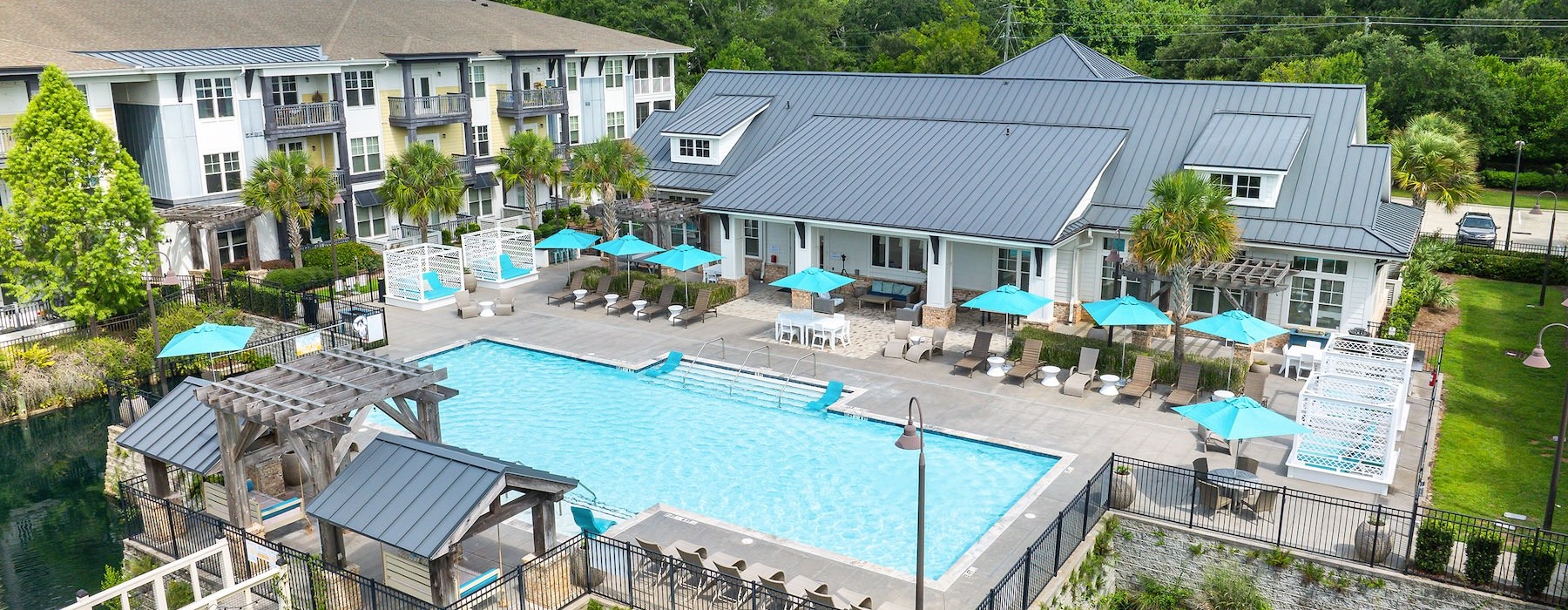 a swimming pool with a building in the background
