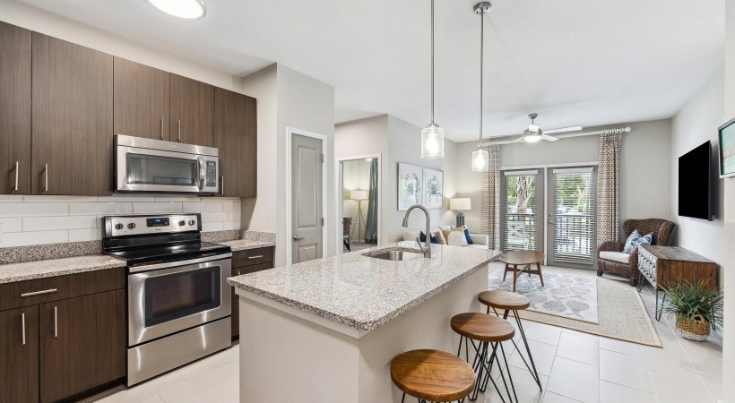 a kitchen with an island and bar stools
