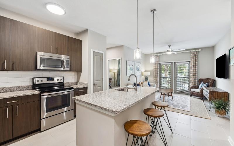 a kitchen with an island and bar stools